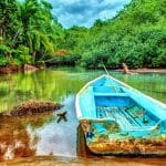 Old boat in tropical river in Costa Rica